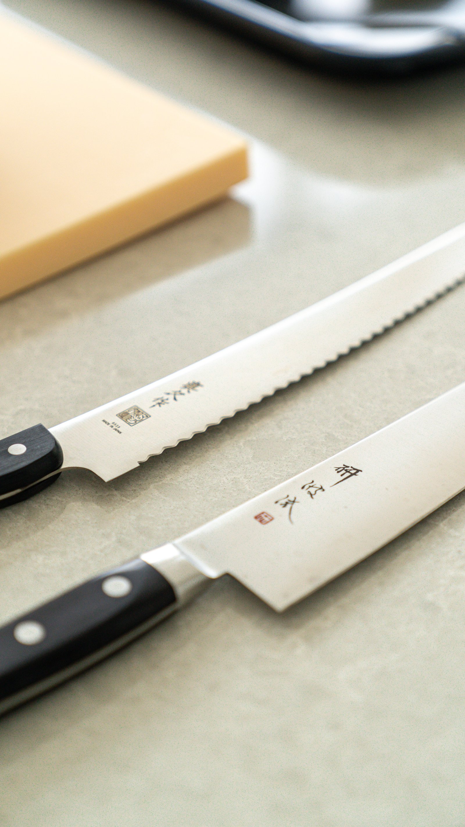 Two Japanese knives on the prep counter