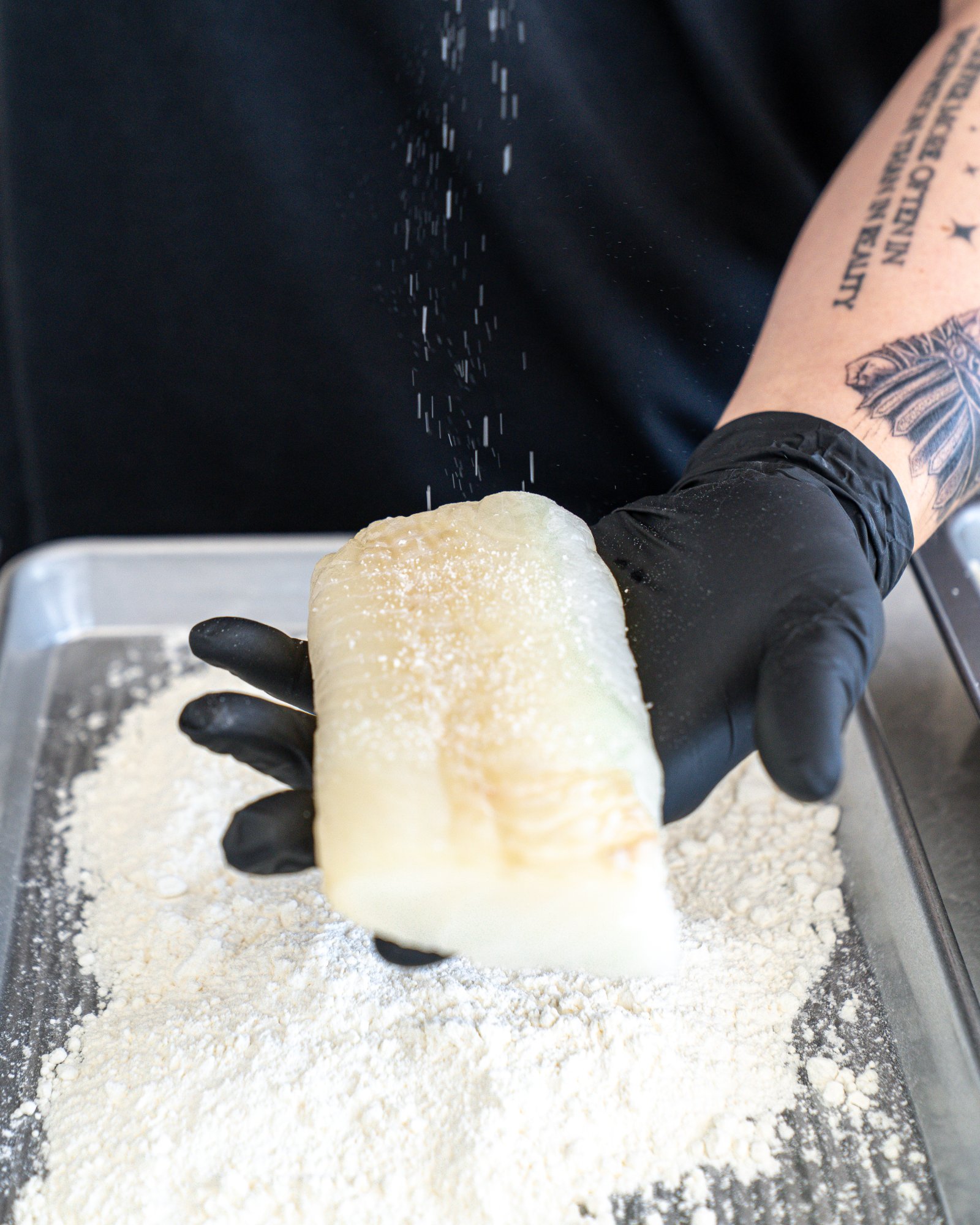 Dredging cod in flour