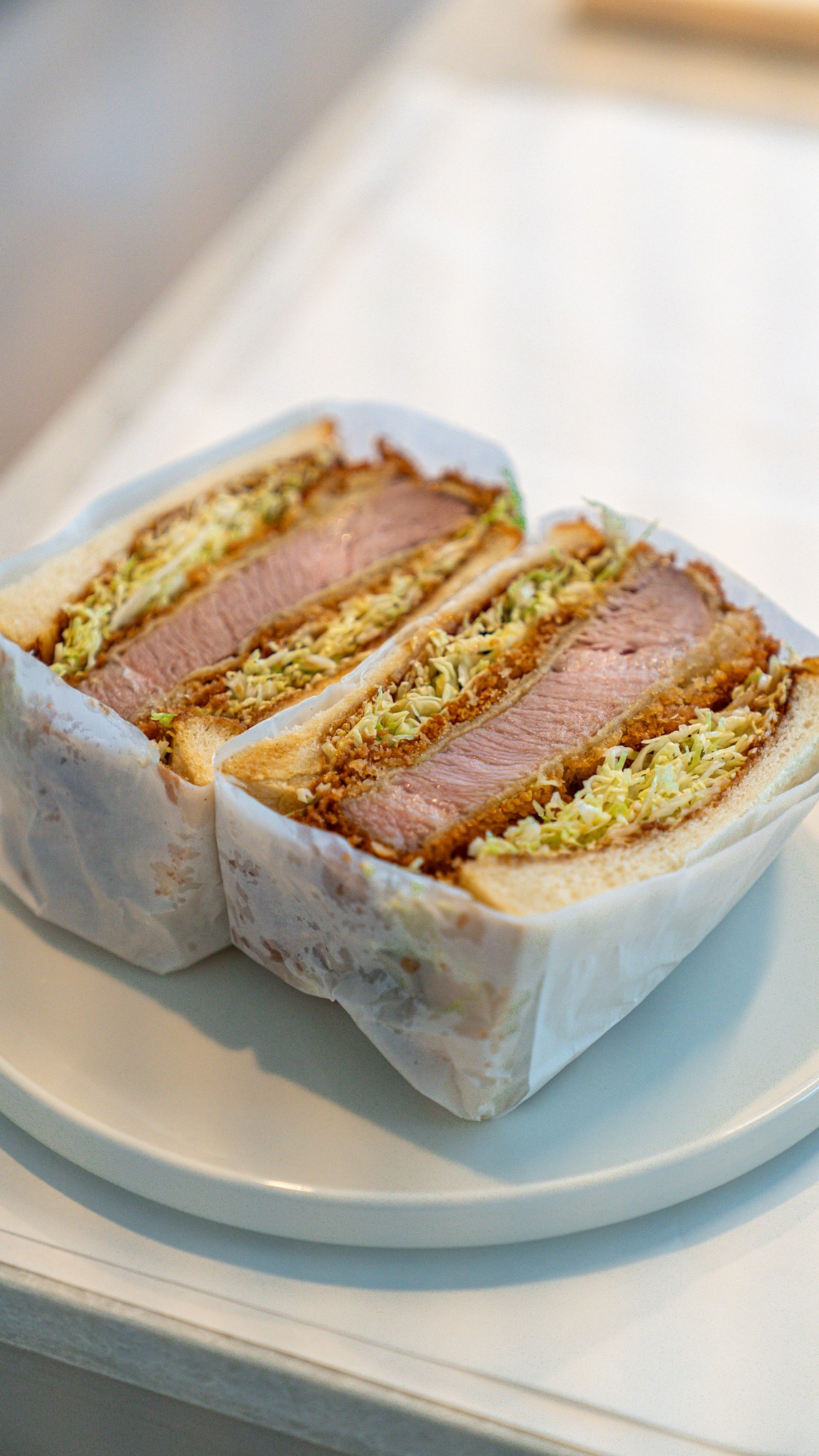 Katsu sando cross-section with a lacy panko crust